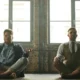 men sitting on floor, meditating